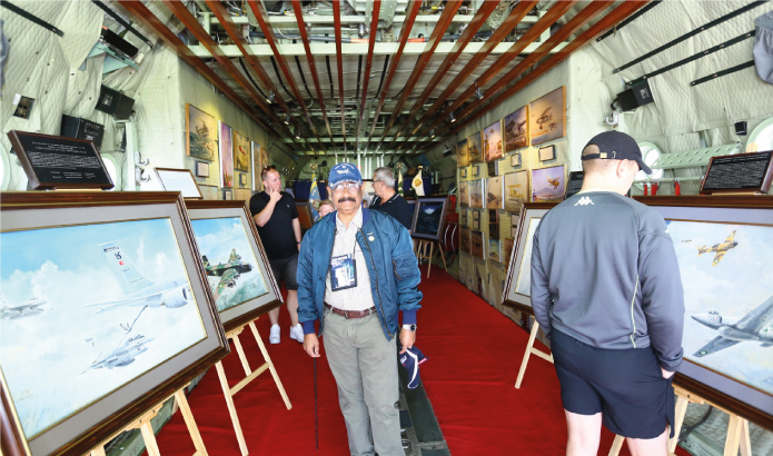 Artist briefs the British from inside the PAF C-130